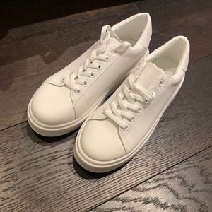 Never worn white 1-inch tall sneakers